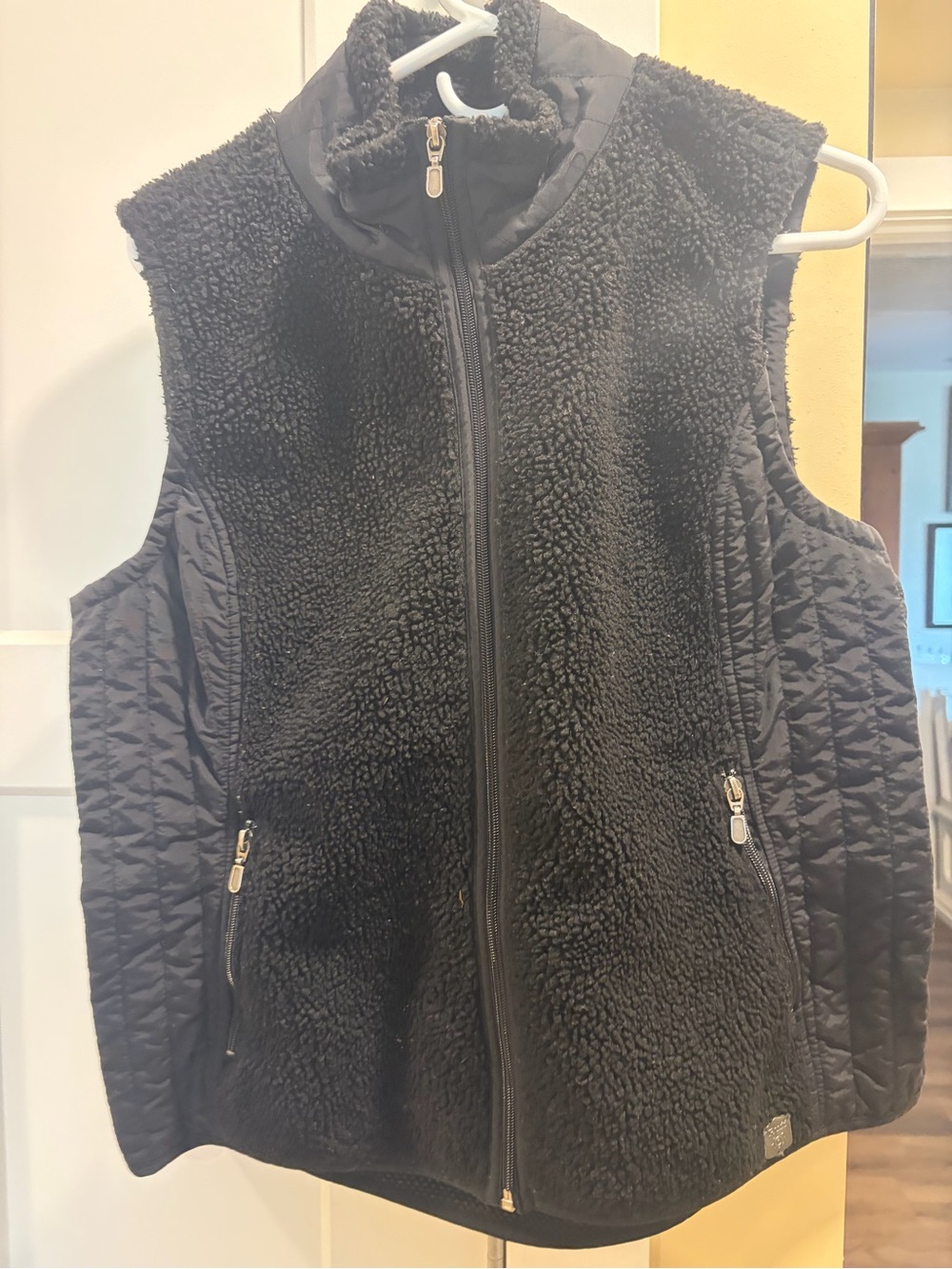 Source Unknown Two vests. Quilted Vests with Zip Pockets